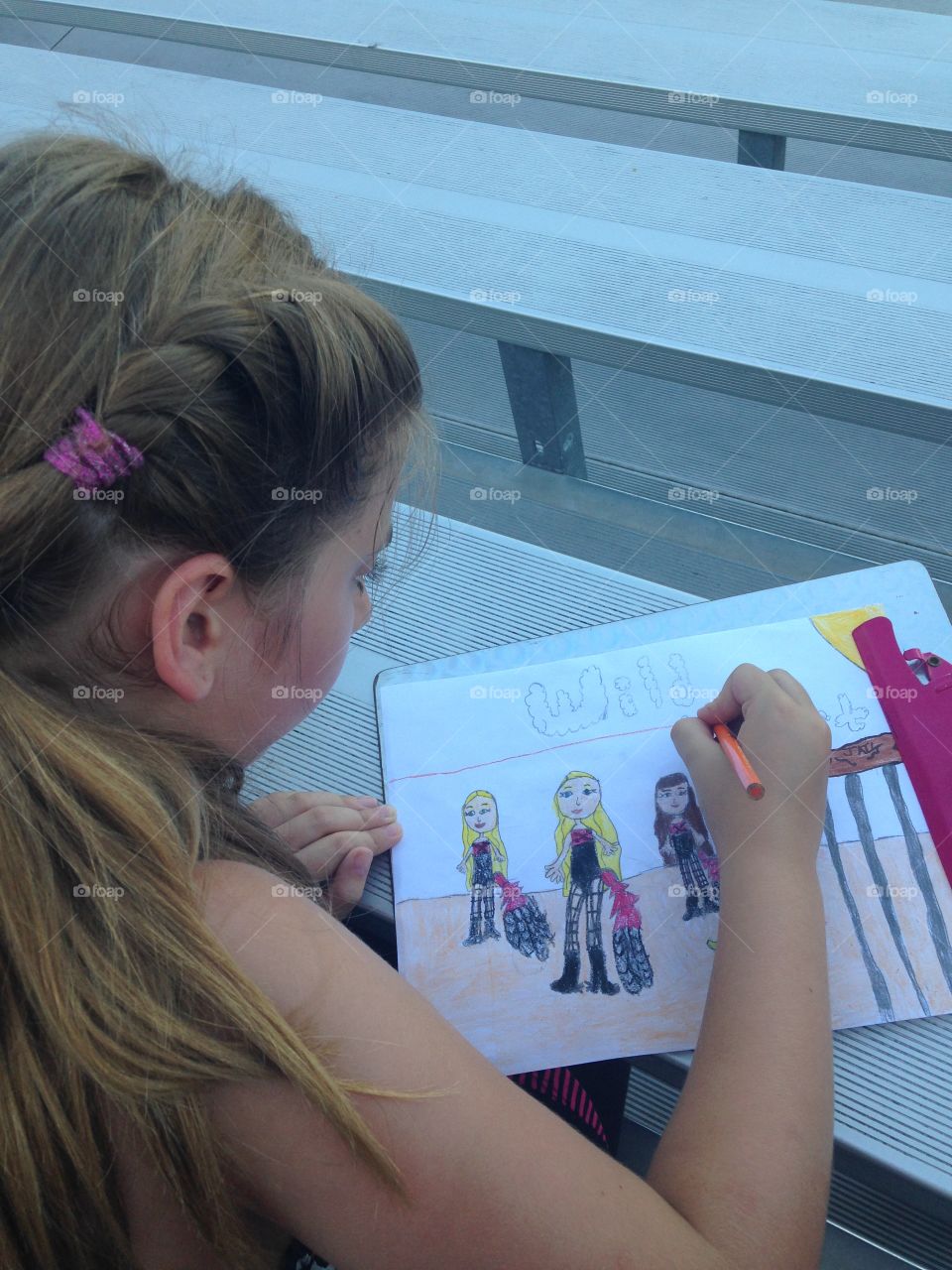 Artist at heart. Girl drawing a Wild West show picture