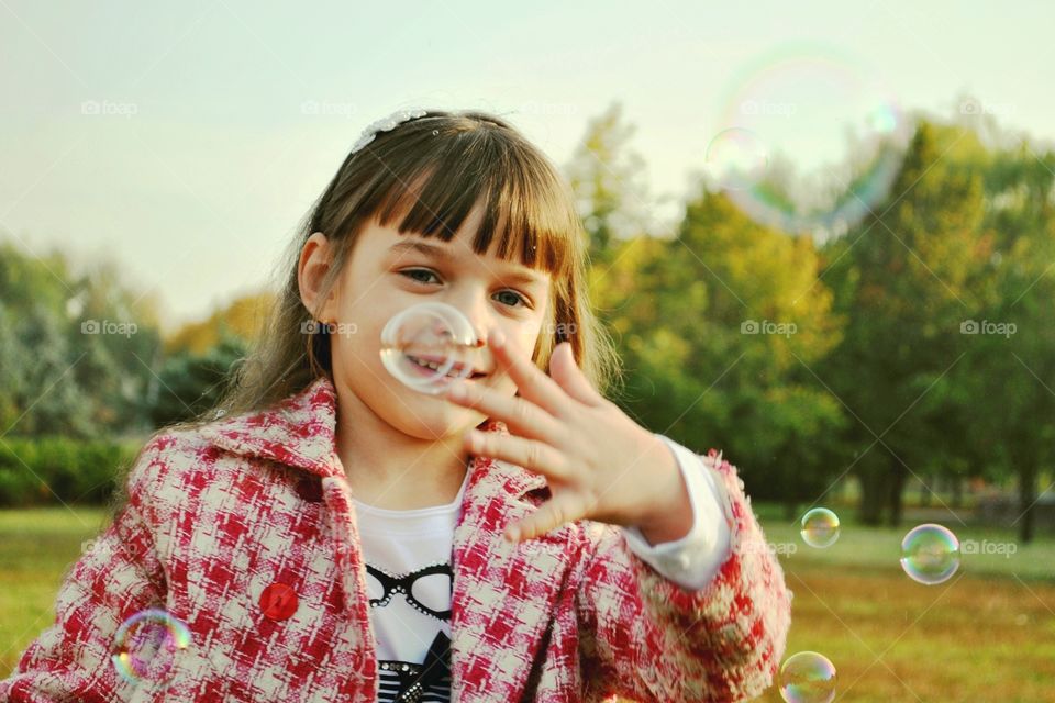 girl and soap bubbles