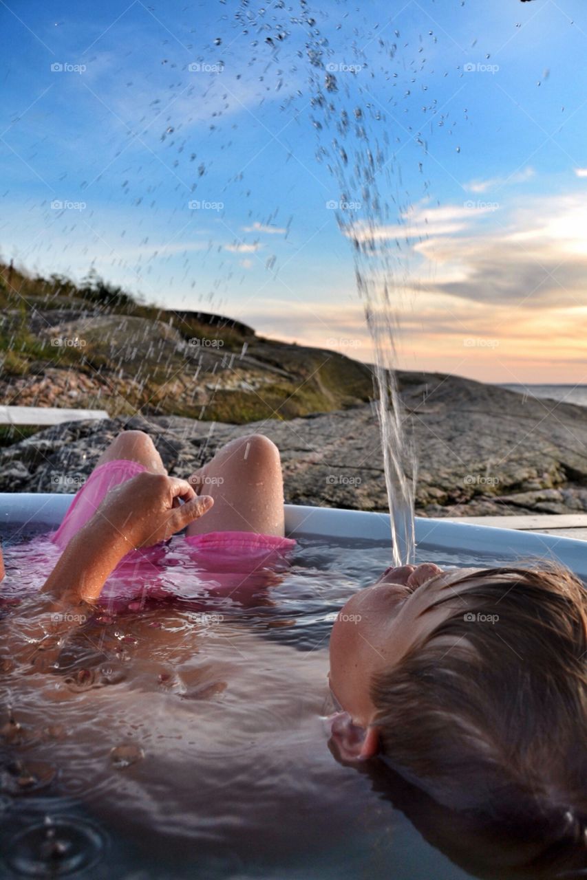 Boy playing with water