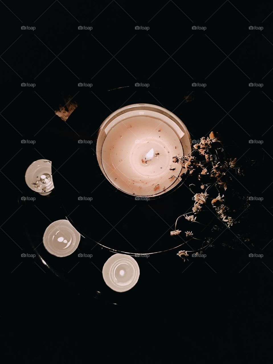 Burning candles on the black background. Fire element, magical ceremony, meditation with herbal incense