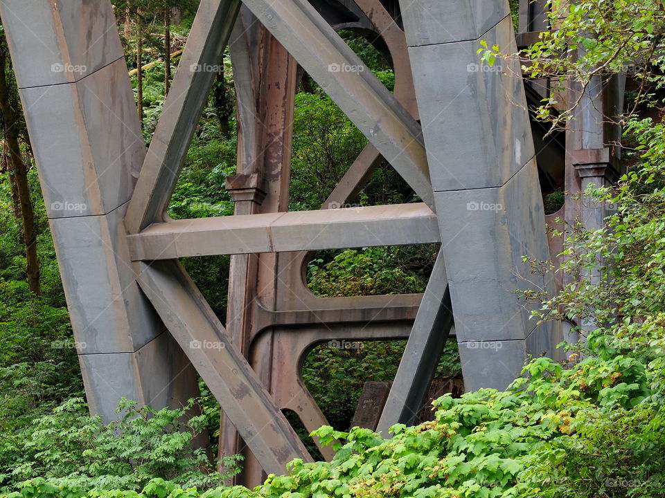 An old bridge that spans the Pacific Coast Highway 101 on the central coast of Oregon shows its pure strength and beautiful stonework. 