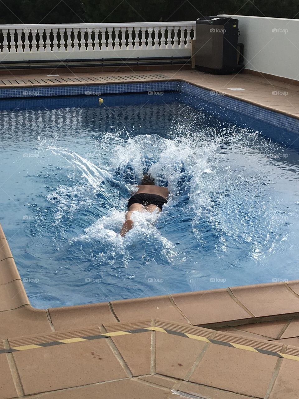 Diving in pool at summertime 