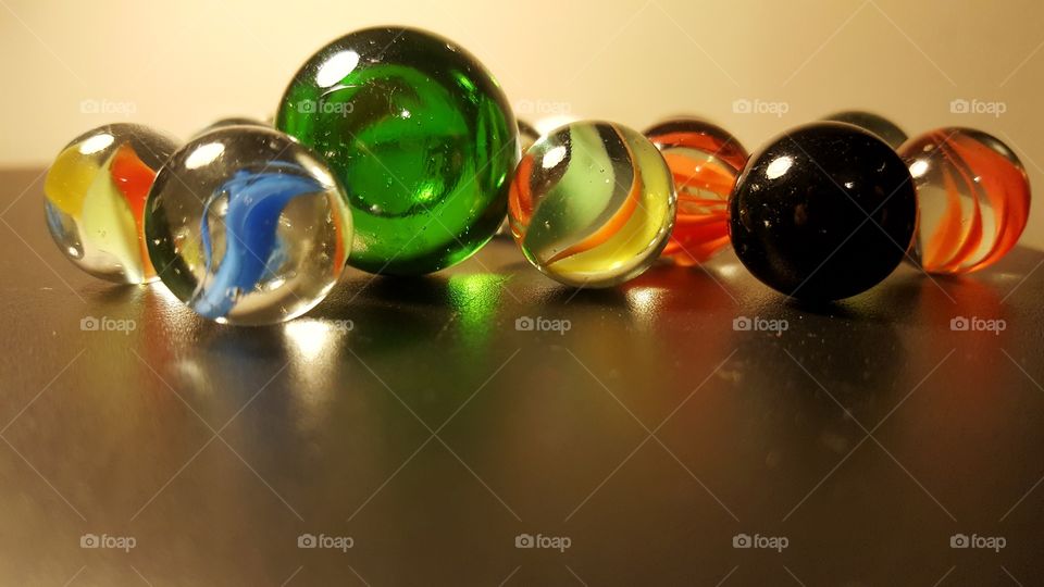 set of marbles on a black table