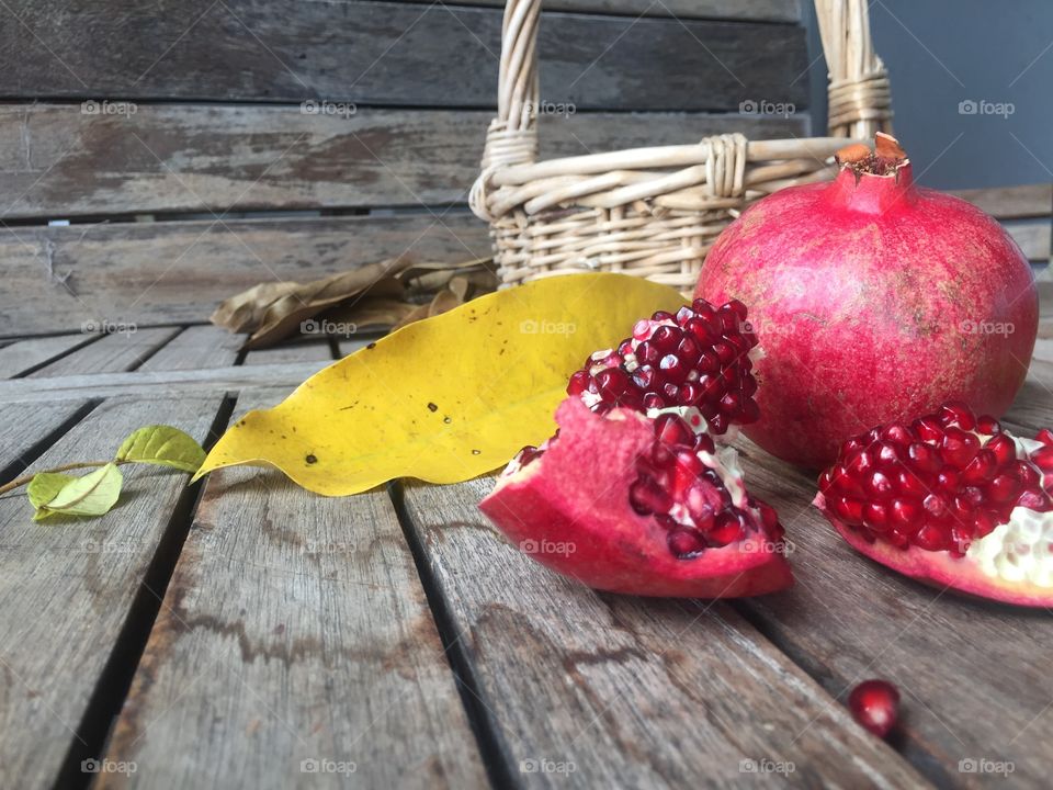 pomegranates, basket and leaf