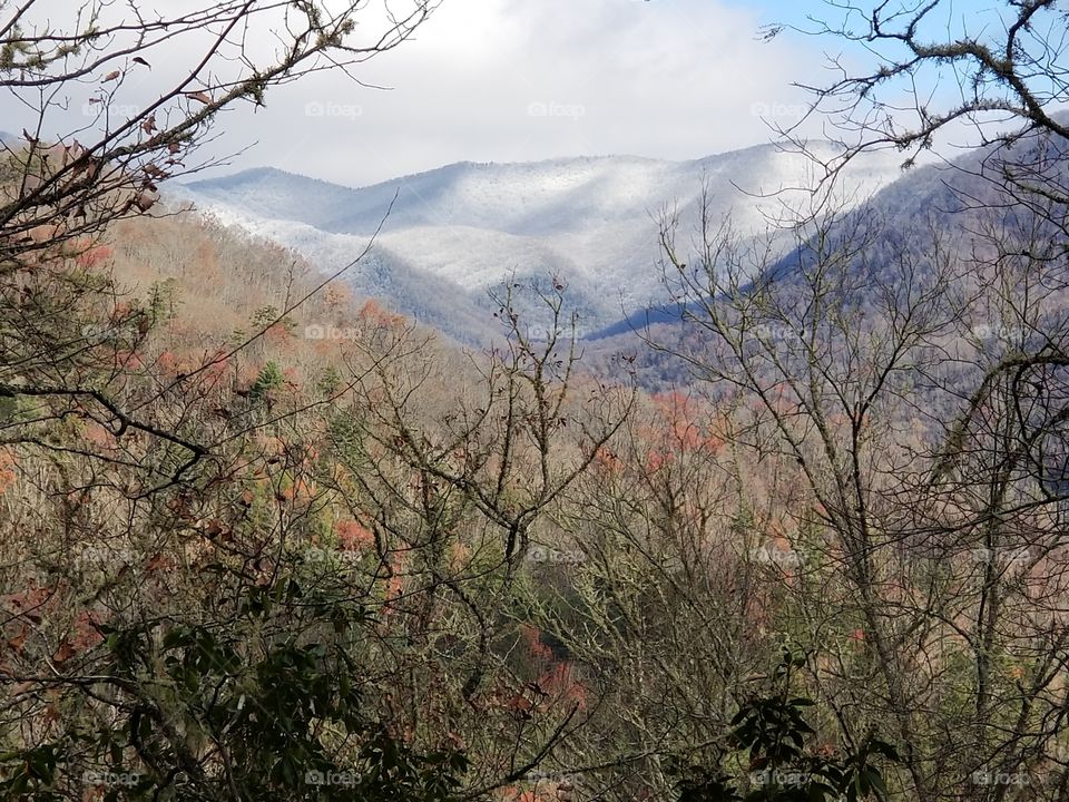 Snowy mountain peaks in the distance at Smoky Mountains National Park.
