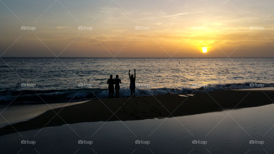 family viewing the sunset