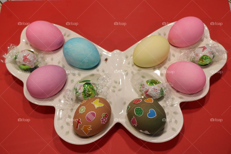 Colourful eggs in a plate