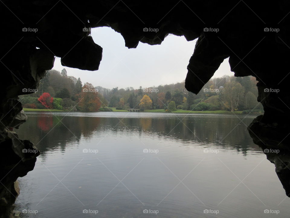 Inside a cave looking through to stourhead lake