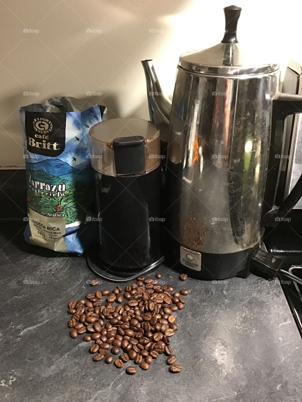Coffee pot with a grinder for beans from Costa Rica 