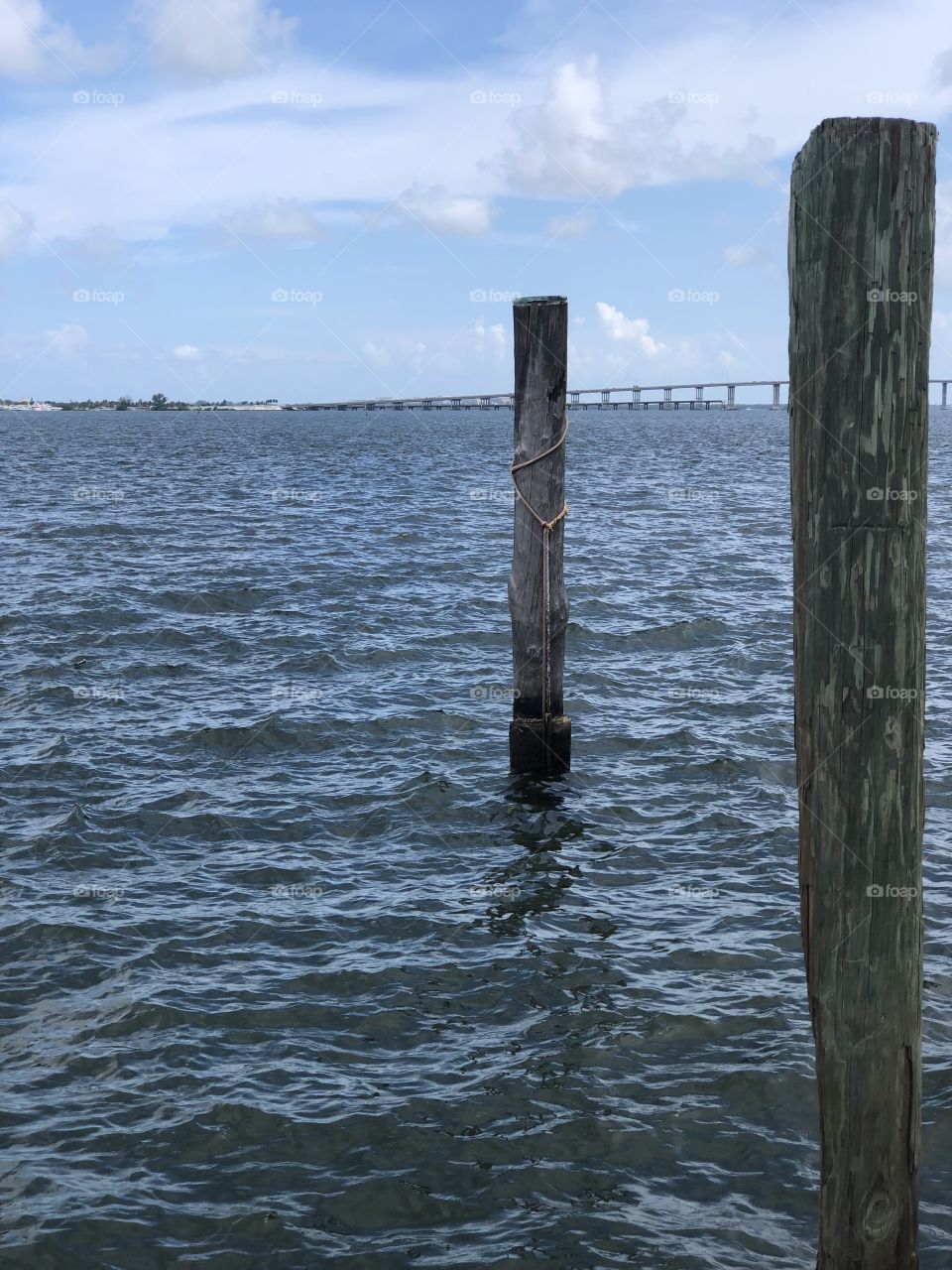 Sitting at the dock on the bay Watching the tides roll away