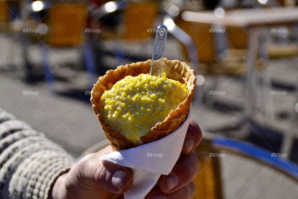 A person holding ice-cream