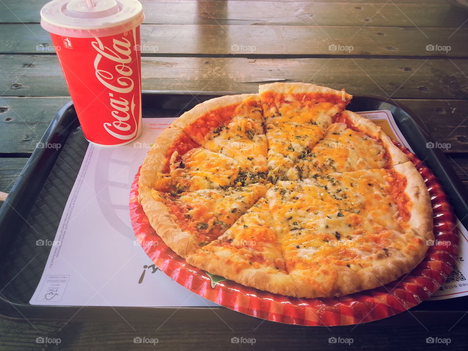 Pizza and Coke. Dinner in Spain