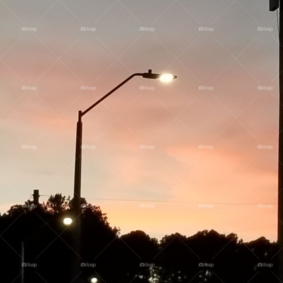 Lamp Post surrounded by Sunset