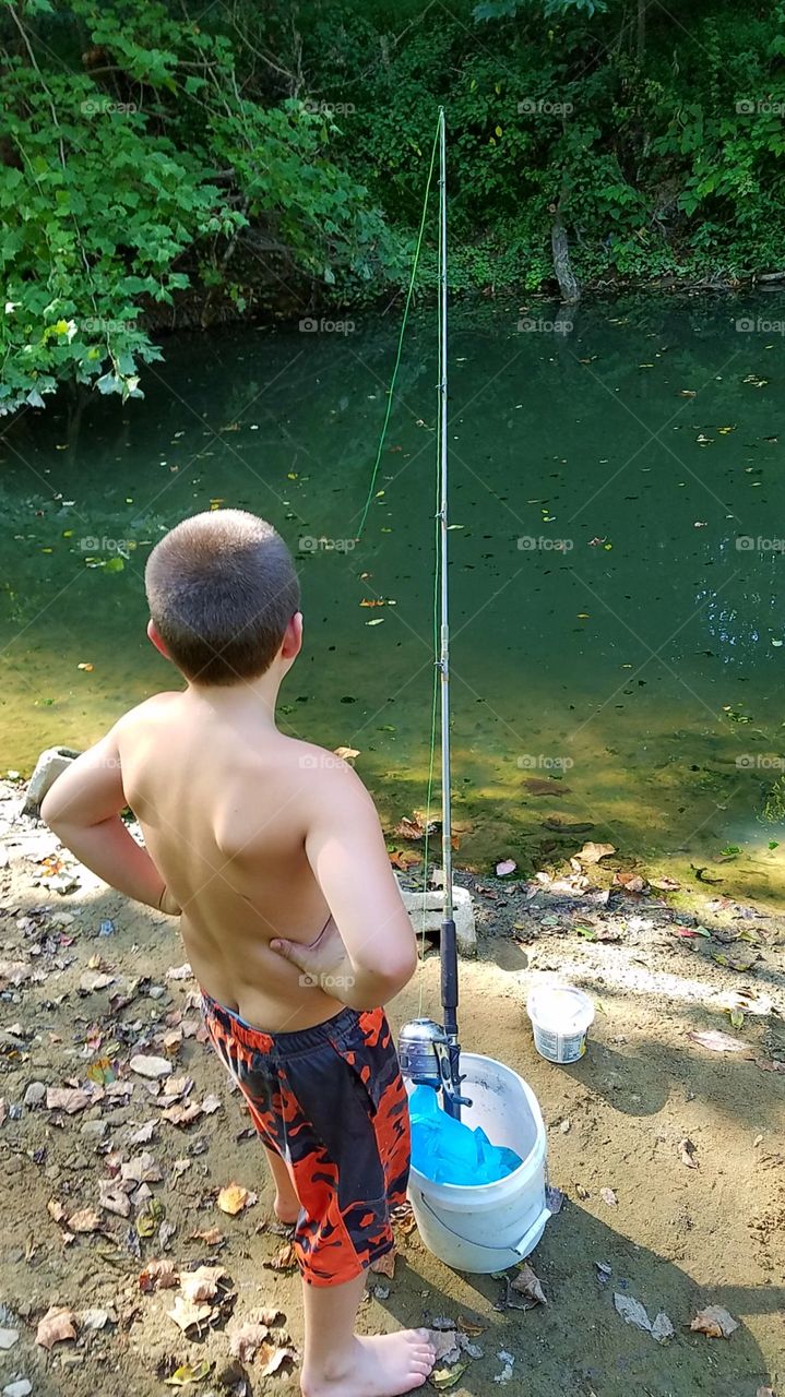 fishing on the creek bank