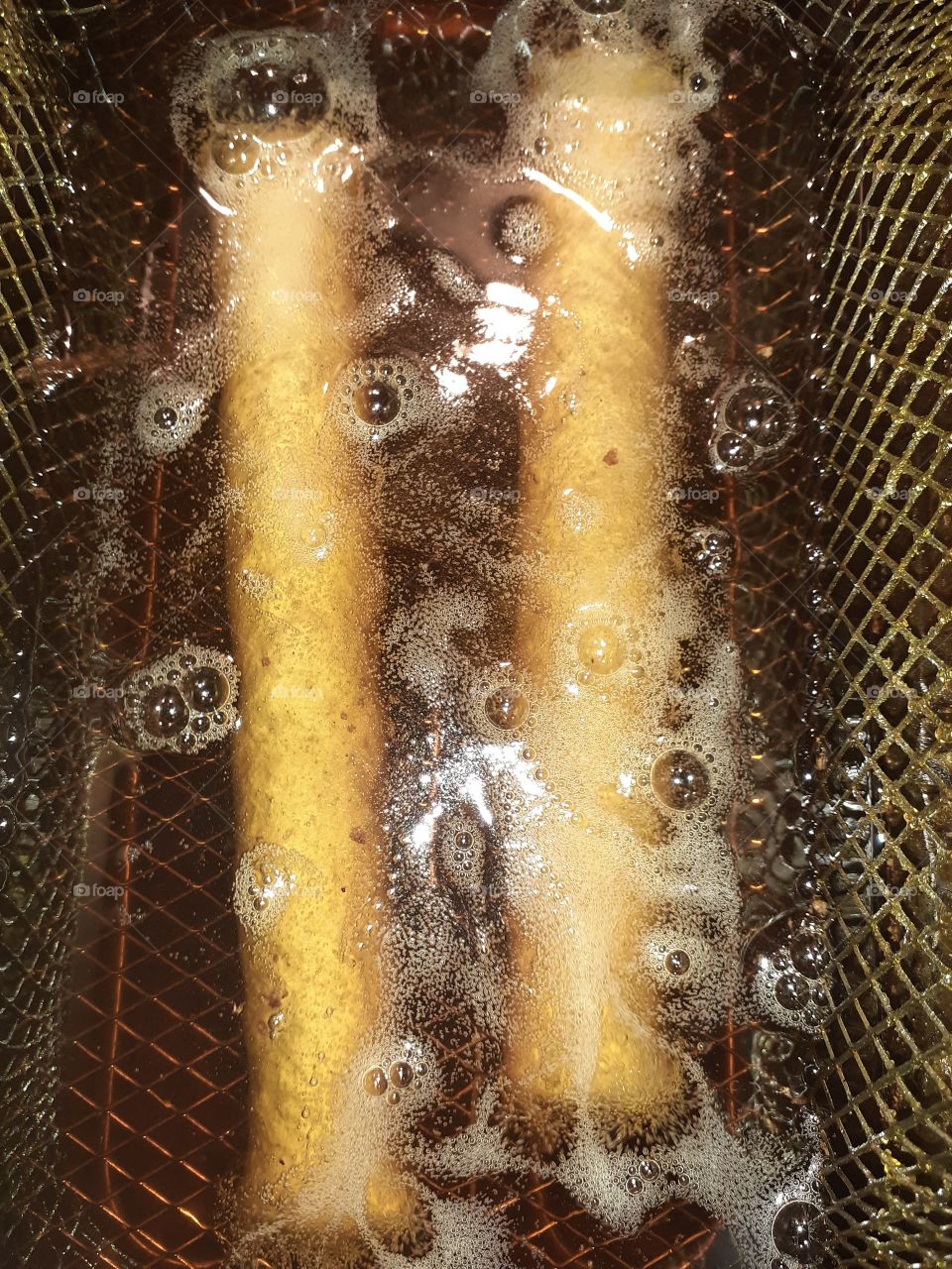 Two fried frikandels