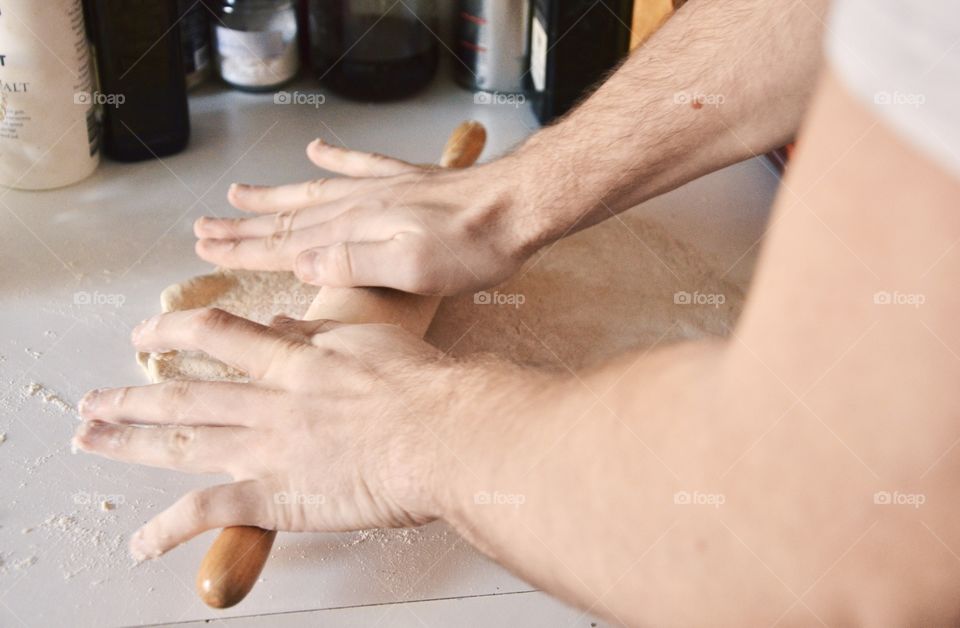 A man making a pizza dough 