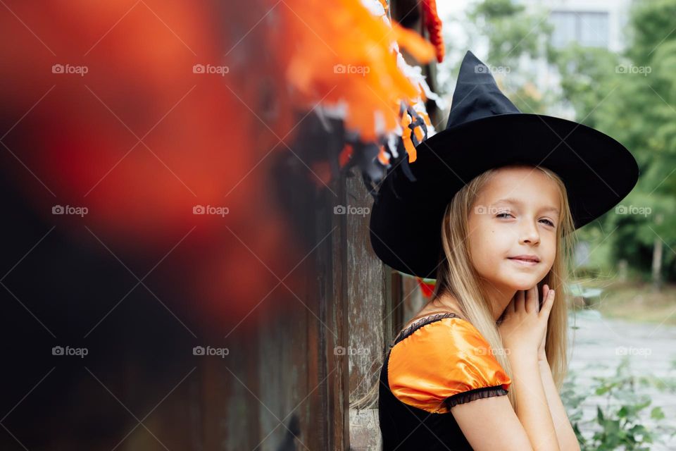 Kid celebrating Halloween outdoor 