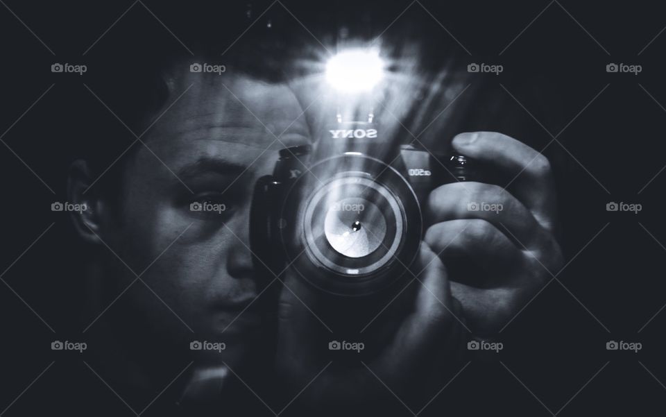 Guy with a camera in black and white