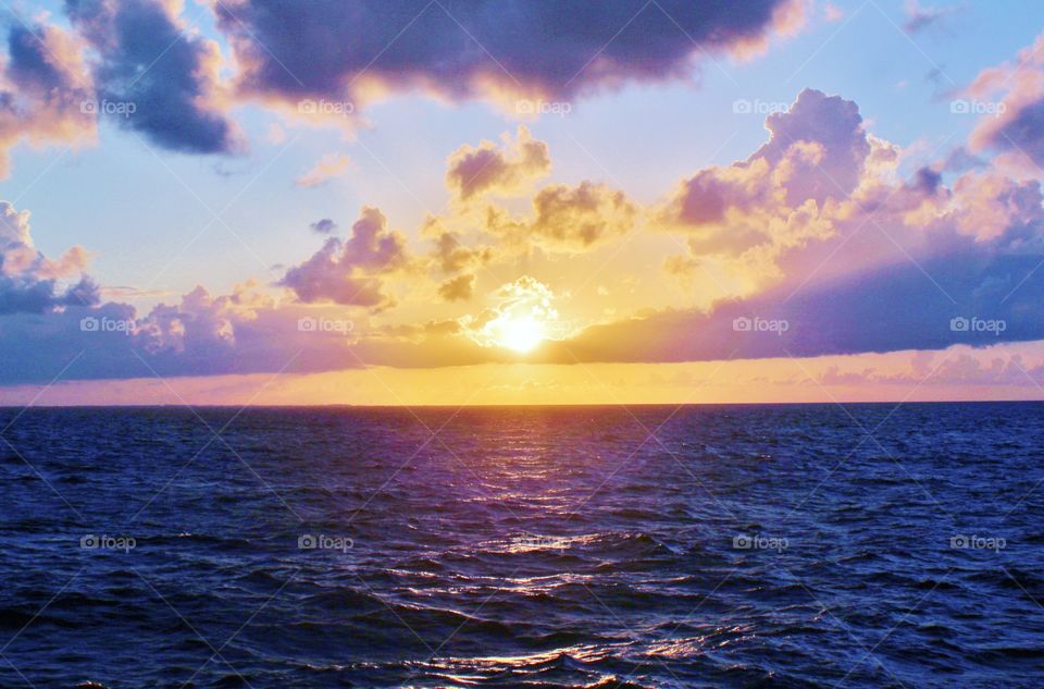 dramatic sunset in the middle of the atlantic ocean