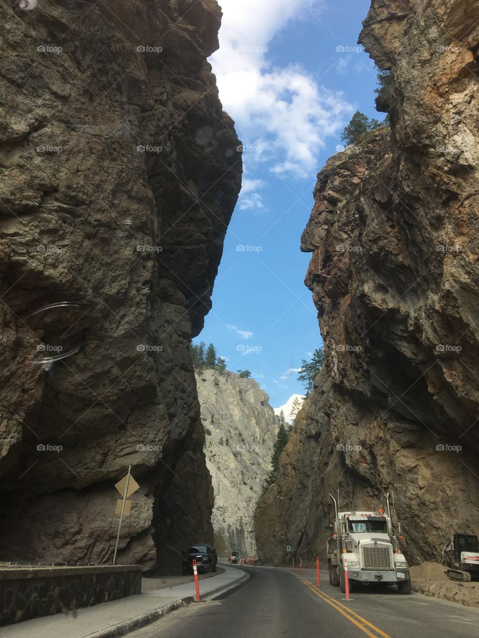 Mountain range adventure. Driving between rock cliffs 
