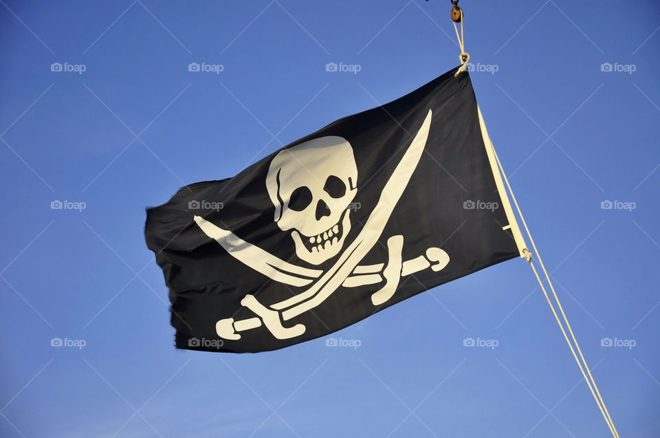 Pirate flag blowing in the wind.