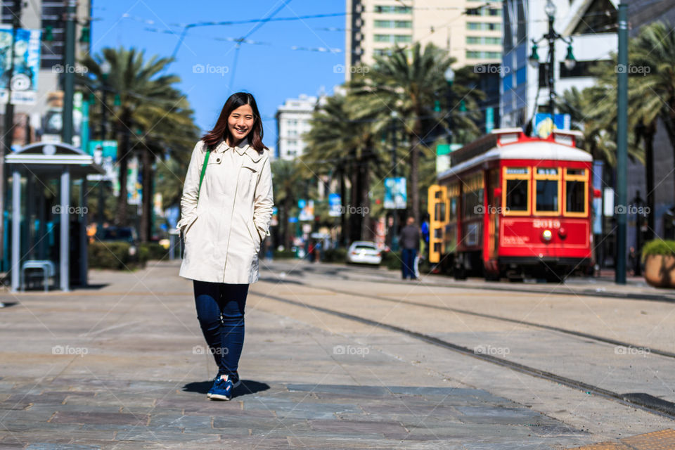 Asian woman posing on street