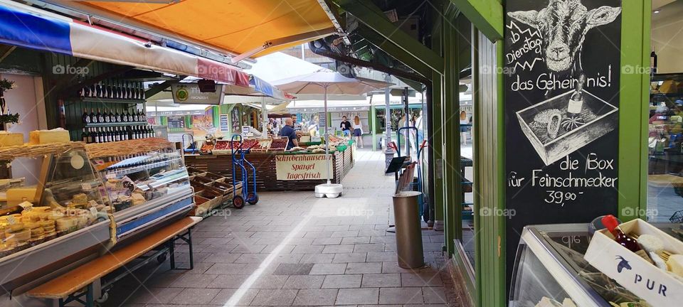 Another view of the gourmet cheese supermarket in “Munich”, capitol of “Bavaria” where exquisite dairy merchandise from all over the World is offered for sale. 2023. Hypnotic Productions