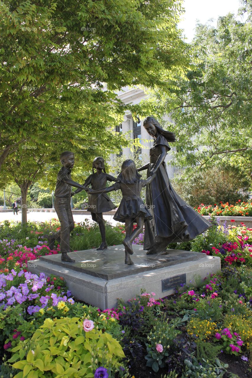 Statue of mother and children . This statue is on the Mormon temple campus is Salt Lake City, Utah