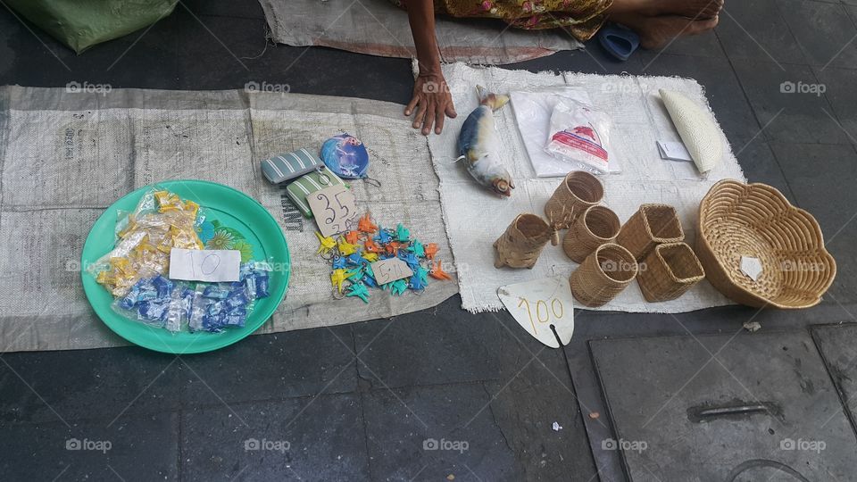 The poor sell miscellaneous goods on the streets of Bangkok Thailand.