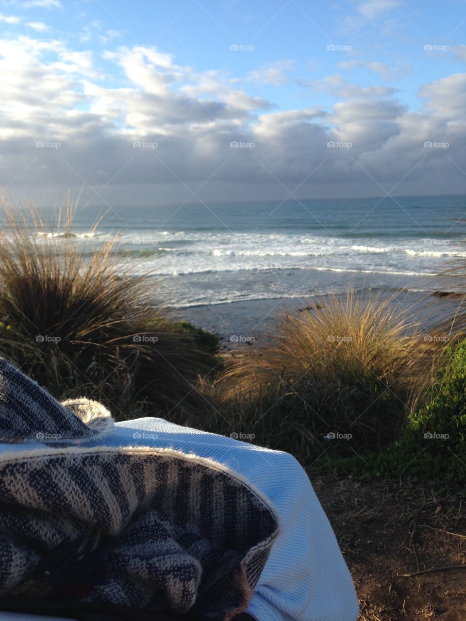 Cosily rugged up to check the morning surf.