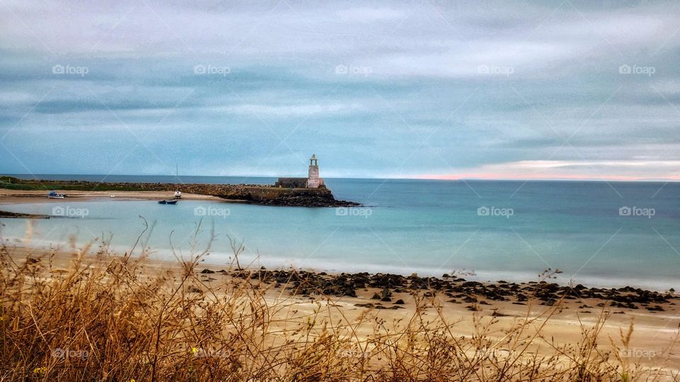 Beautiful smooth waters with old lighthouse