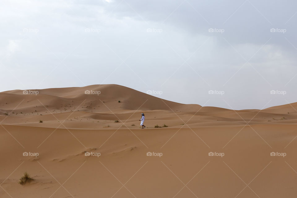Berber Walking in Sahara Desert