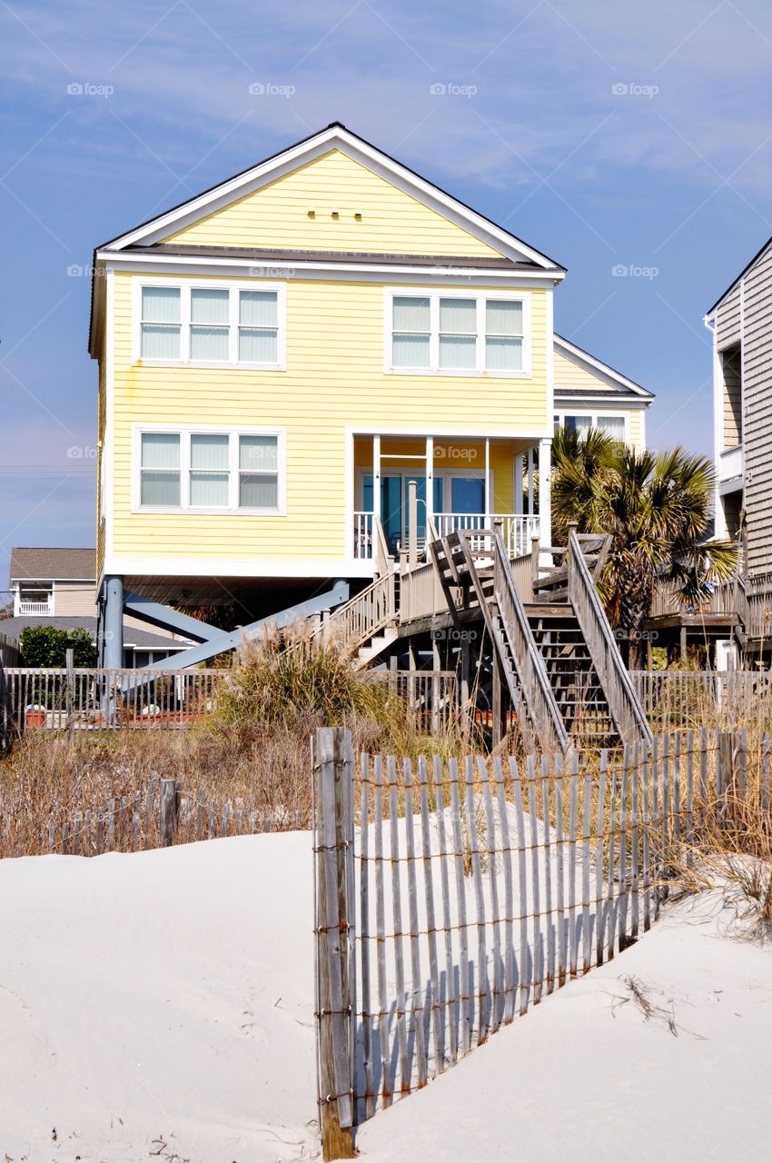 Yellow oceanfront beach house 