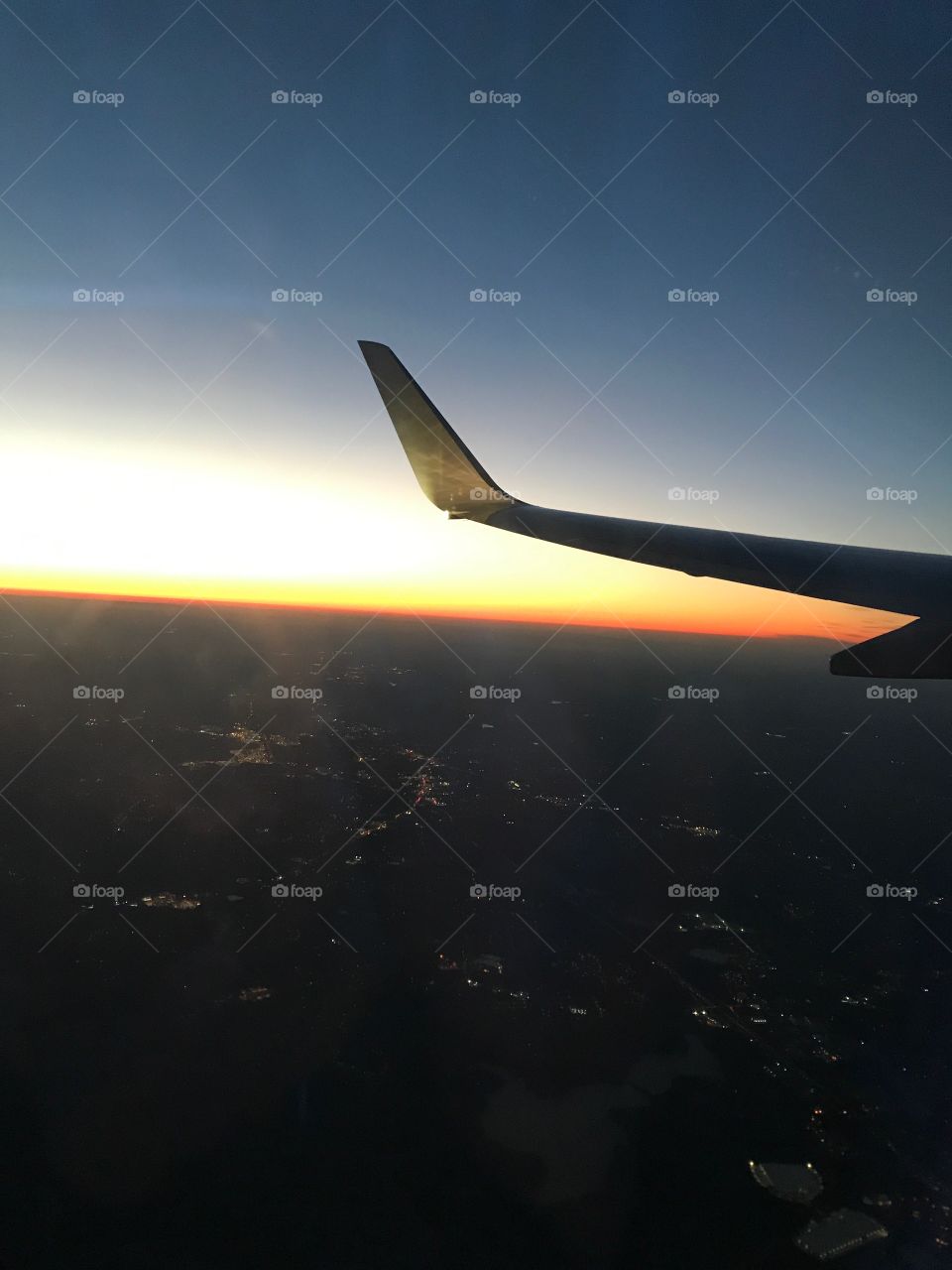 Airplane wing at sunrise 