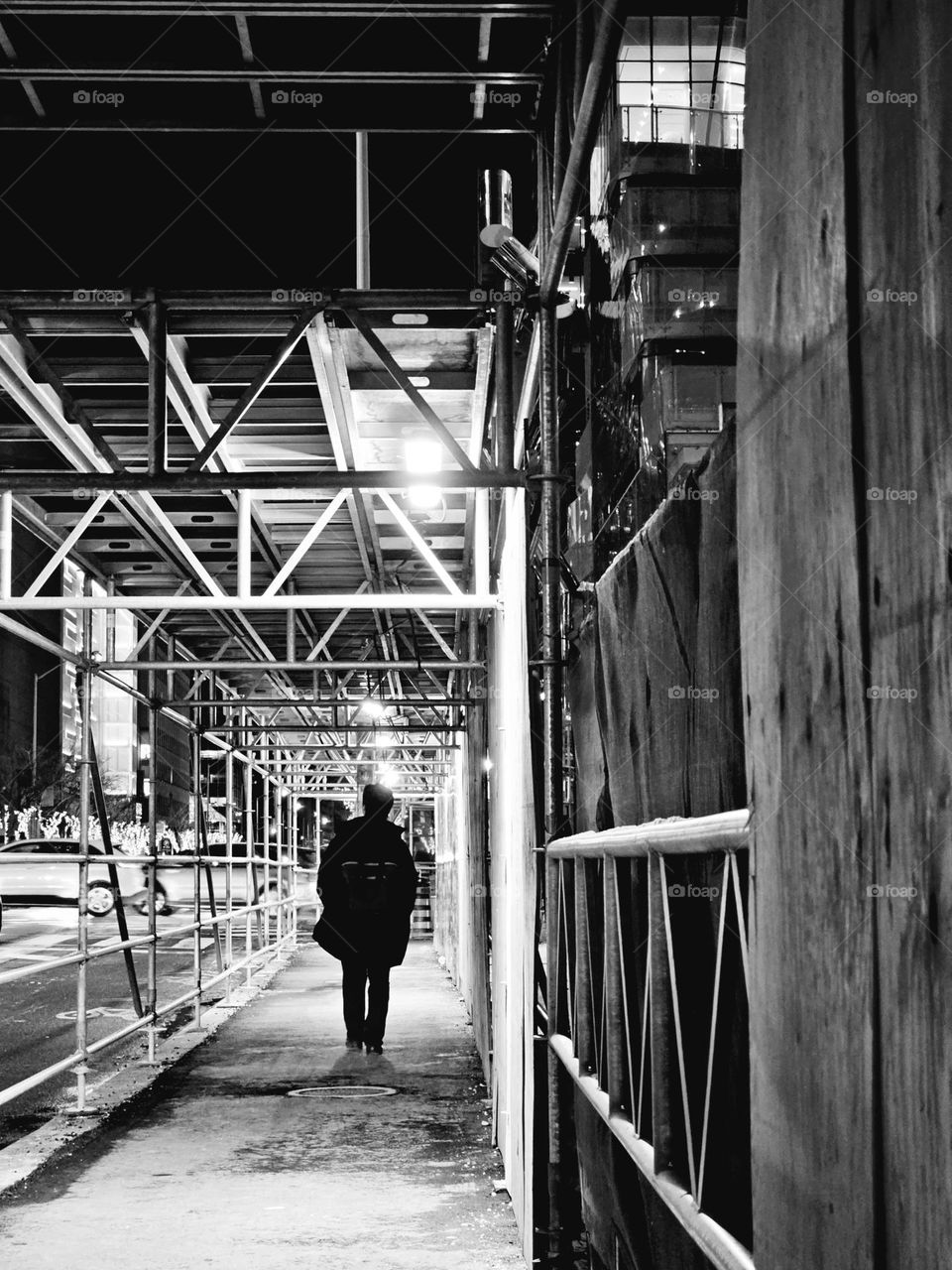 Man walking on the street at night