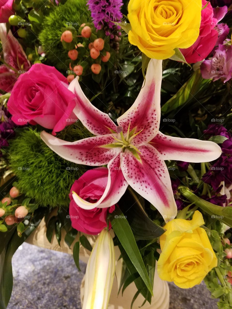 Red Lily in center of large bouquet table