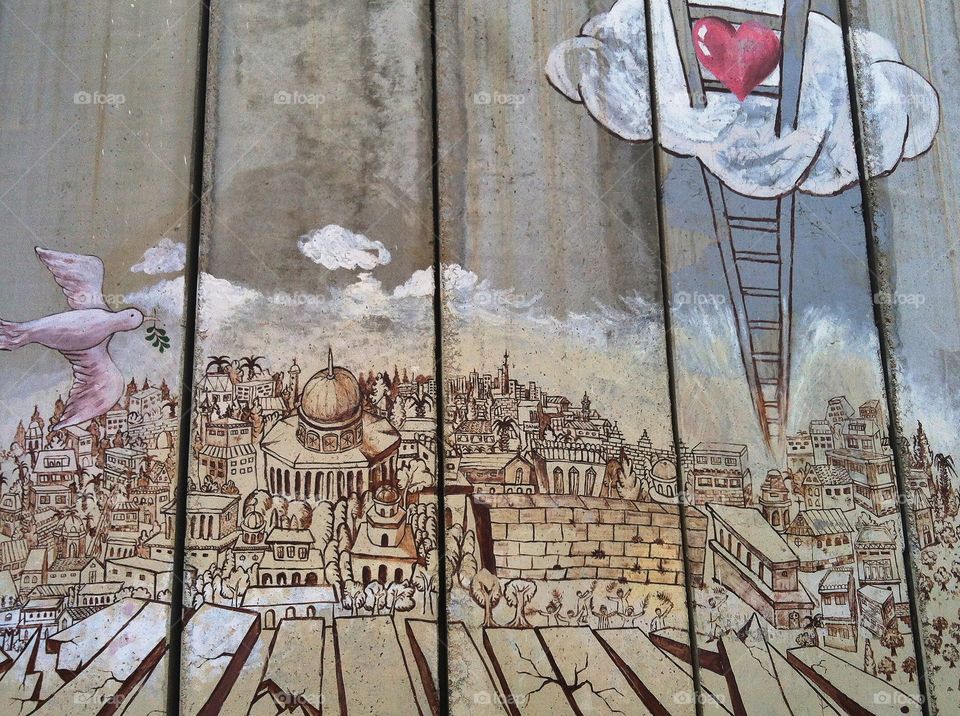 Pray for the peace of Jerusalem: graffiti art on the walls surrounding Bethlehem 