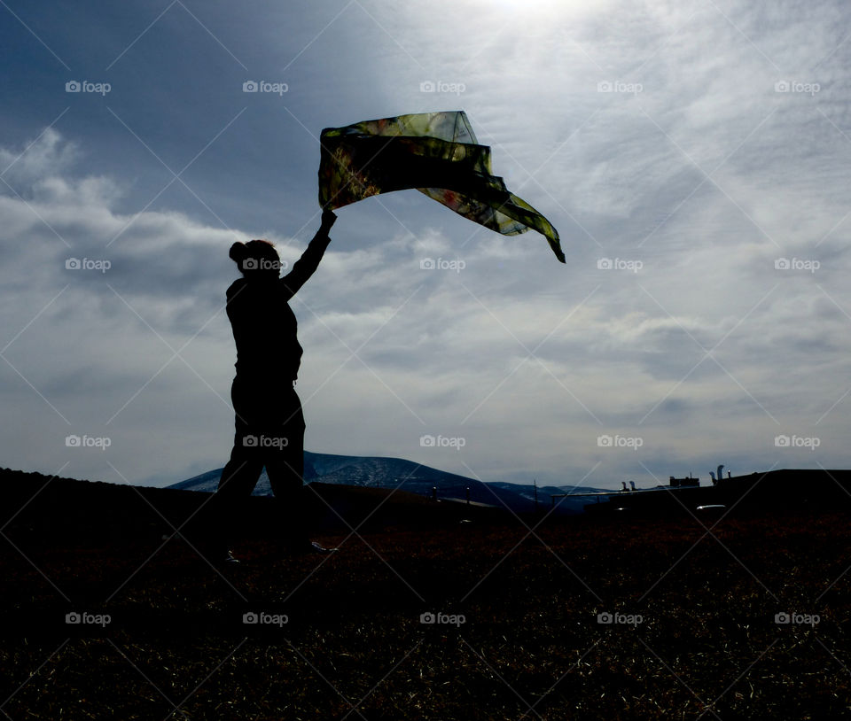 Waving a scarf Silhouette