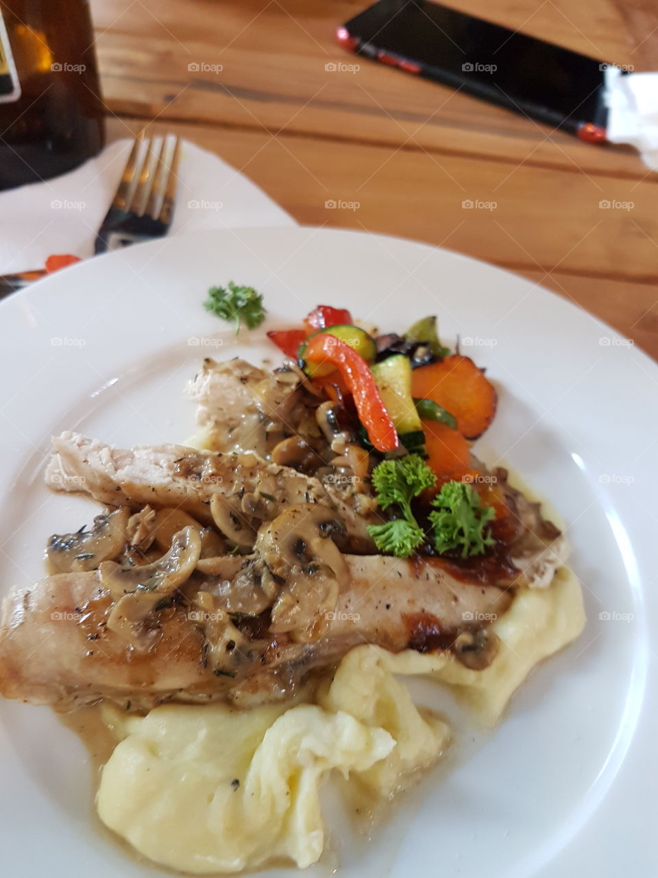 mashed potatoes, chicken, veggies and mushroom sauce.