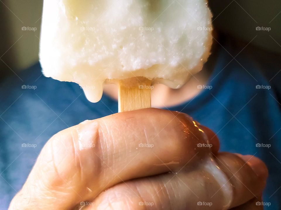 Liquids are cool!  From solid to liquid ice-cream melts down a man's hand while holding an ice-cream.