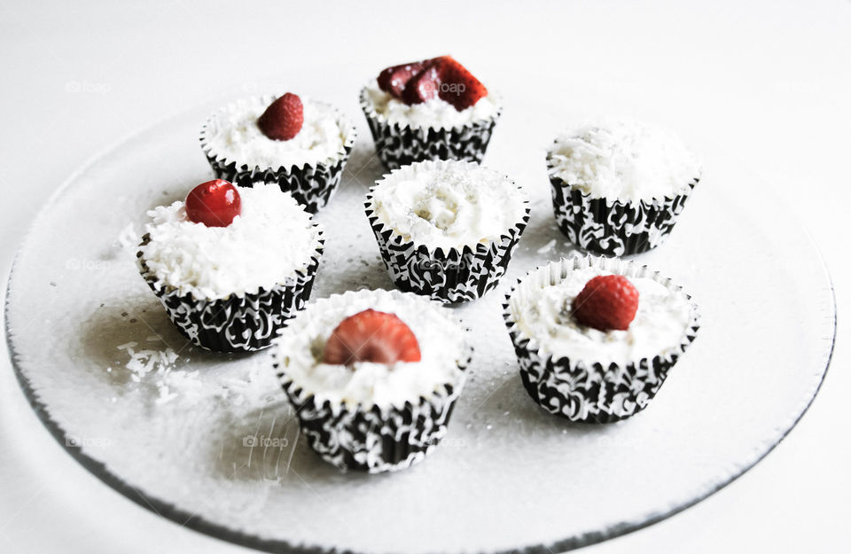 Cupcake with berries in plate