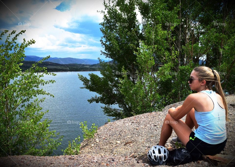 Girl viewing lake in the mountains in Colorado