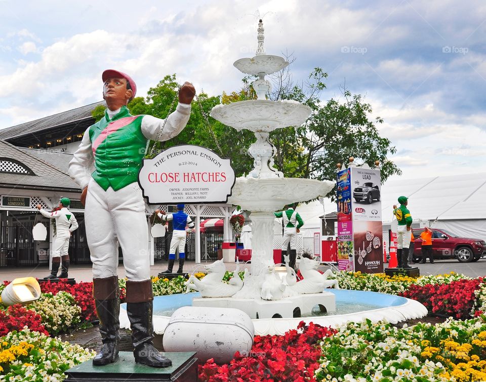 Close Hatches. Last year's major stakes winners at the Spa get their owner's colors painted on the iconic lawn jockeys. 
Fleetphoto 