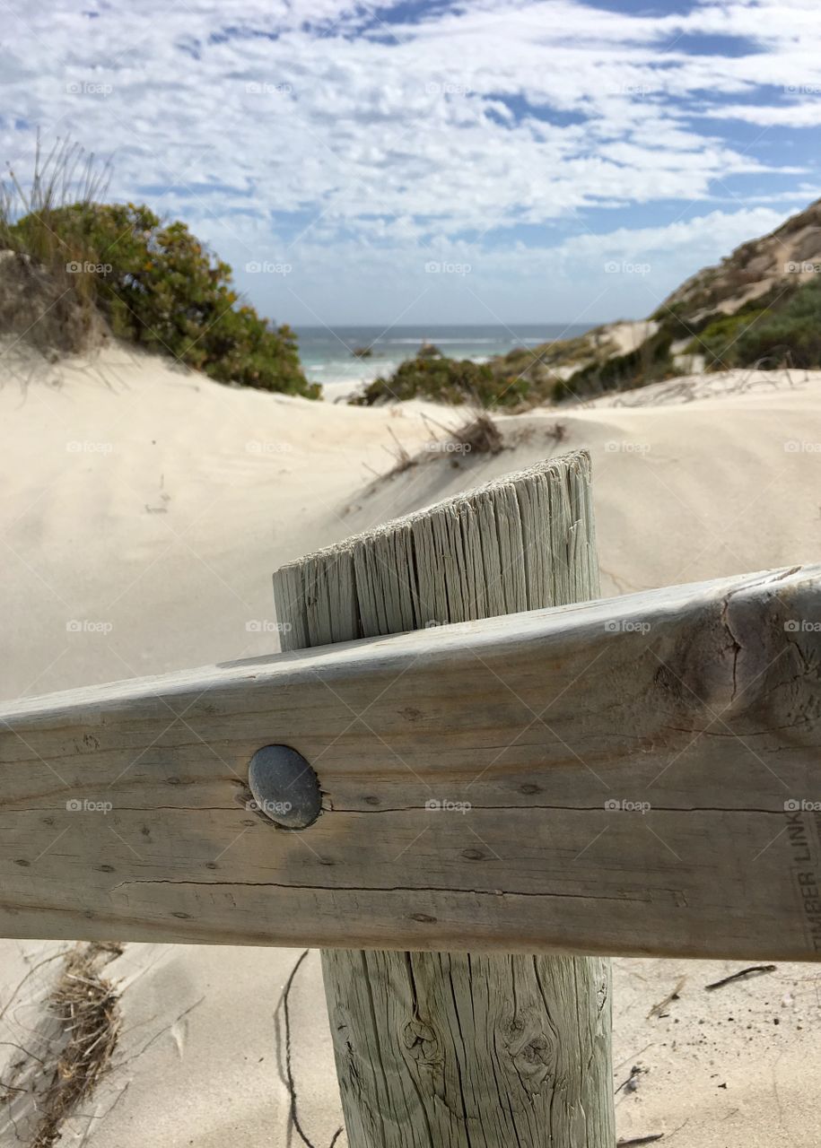 Journey to the sea, a Samsung path toward a secluded beach in south Australia view from a weathered wood handrail 