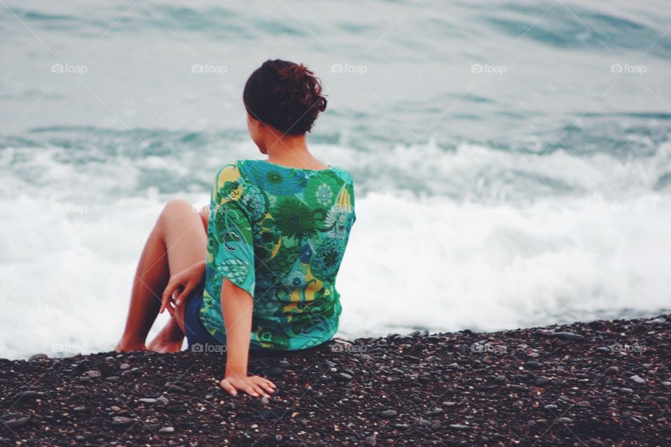 Brunette alone at the beach 