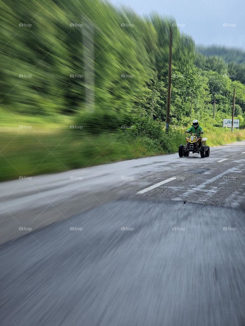 with the ATV on the road in the forest