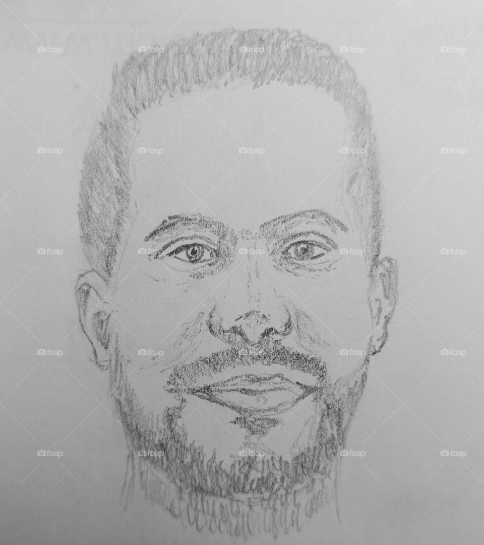 A man with a kind face and beaming eyes.