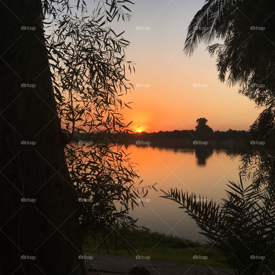 Sunset in Luxor, Egypt, by the Nile river.