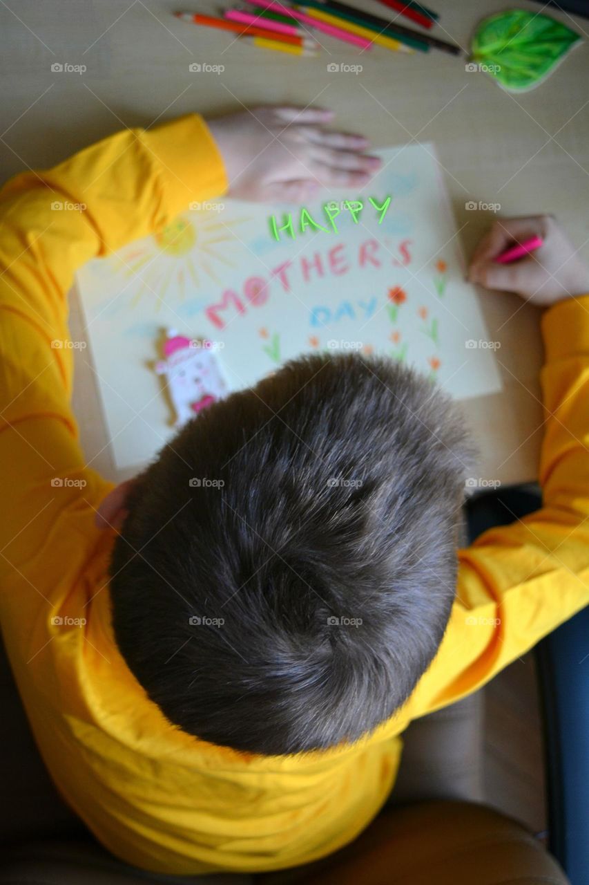 child boy drawing pencils, creative kind