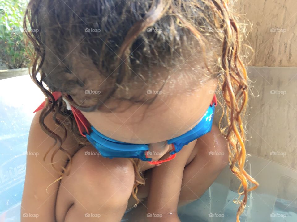 Little girl with swimming goggles